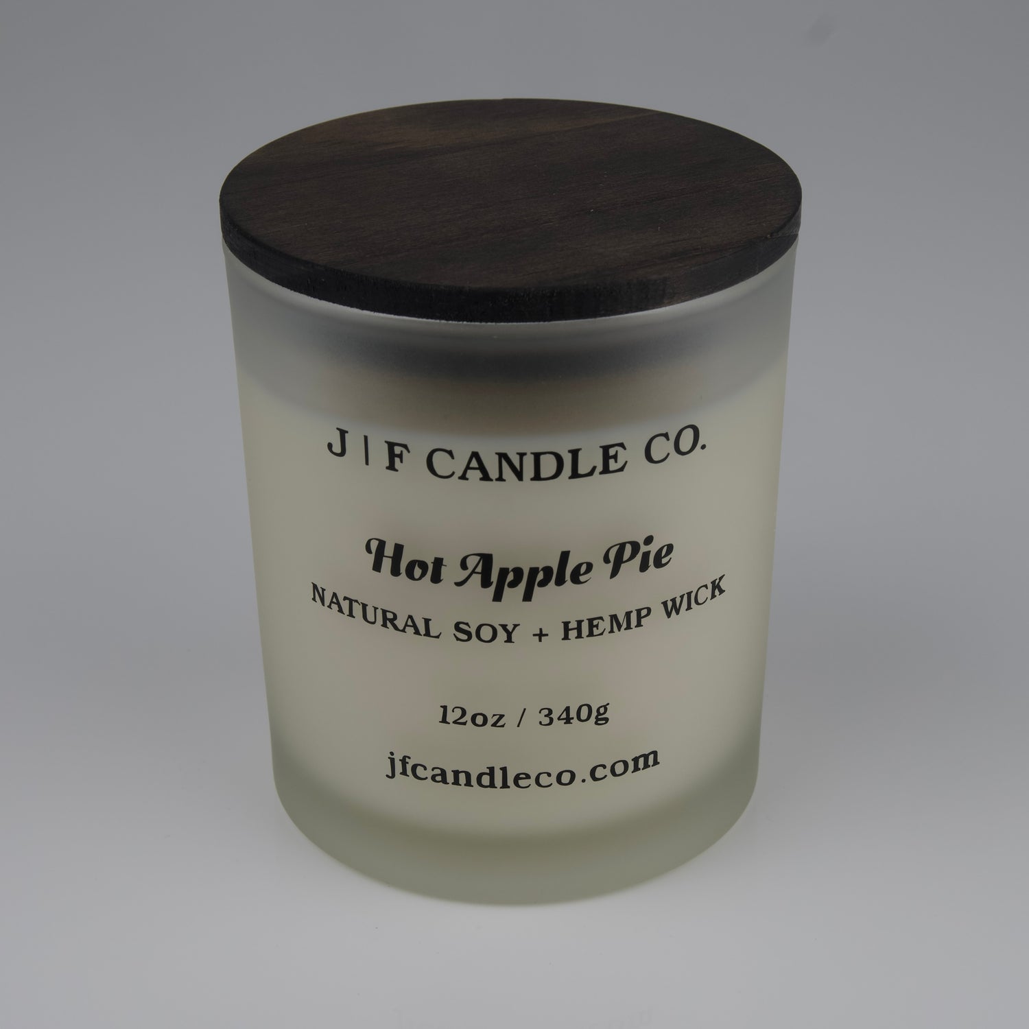 Hot Apple Pie Soy Candle by JF Candle Co. in a frosted glass jar with wooden lid, 12oz hand-poured natural soy wax with hemp wick.