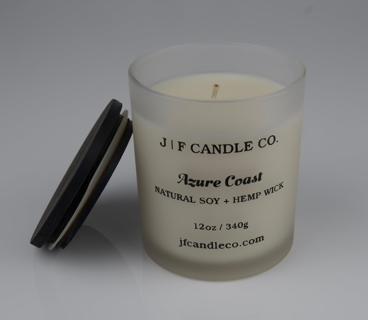 Candle with 'J/F Candle Co.' branding