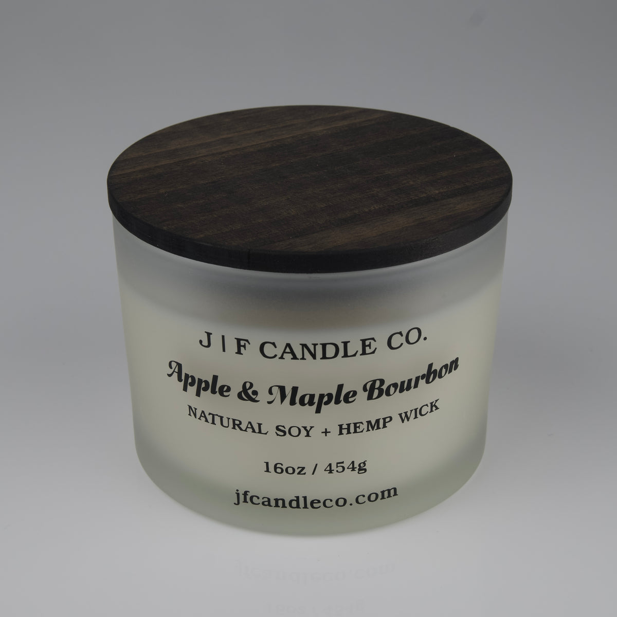16oz Frosted candle jar with brown lid and labeled Apple and Maple Bourbon