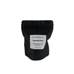A black resealable stand-up pouch with a white label reading 'JF CANDLE CO. Brandied Pear' on a plain white background.