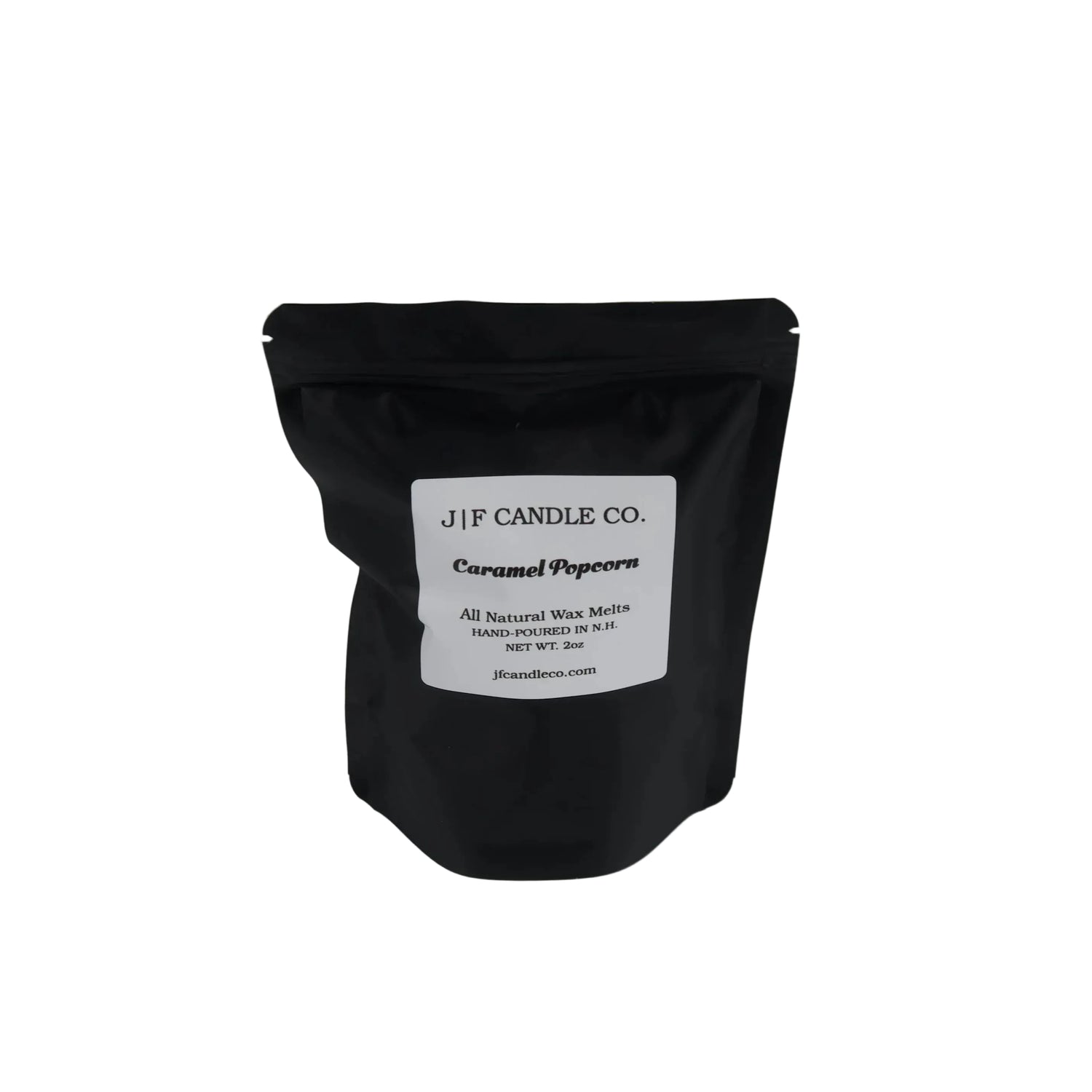 A black resealable stand-up pouch with a white label reading 'JF CANDLE CO.' and 'Caramel Popcorn' on a plain white background.