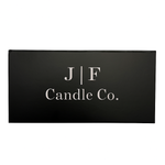 A closed black rectangular gift box from 
J | F Candle Co. featuring the brand’s minimalist white logo centered on the lid, photographed against a clean white background.