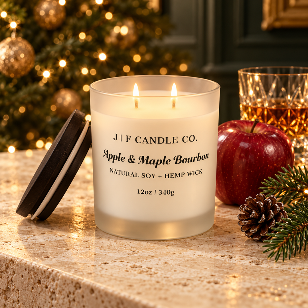 Lit JF Candle Co. Pumpkin Pie soy candle styled in a warm fall setting