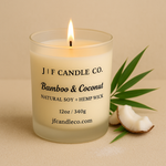 Bamboo & Coconut natural soy candle with hemp wick by J | F Candle Co., displayed lit with coconut pieces and bamboo for a tropical clean scent.