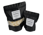 Two black resealable stand-up pouches of JF Candle Co. Branded Pear wax melts, with one larger bag and one smaller bag, both showing white wax pieces through clear windows on a white background.