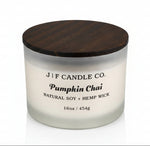 J | F Candle Co Pumpkin Chai 16oz luxury soy candle in frosted glass jar with wooden lid and soft reflection on white background