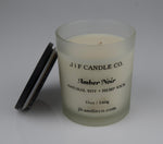 Amber Noir Frosted glass candle with 'JF Candle Co.' label