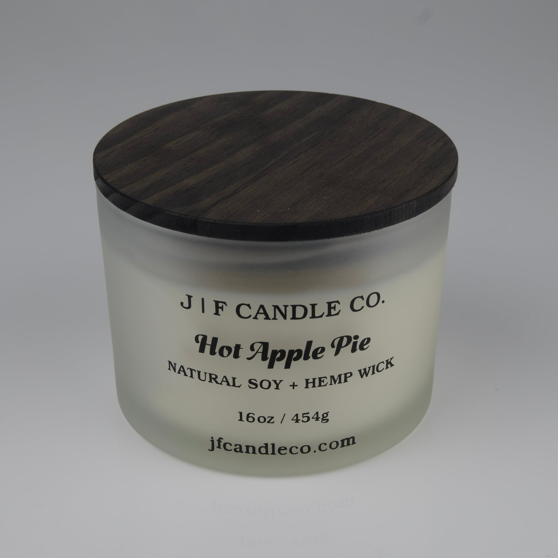 Hot Apple Pie Soy Candle by JF Candle Co. in a frosted glass jar with wooden lid, 16oz hand-poured natural soy wax with hemp wick.