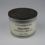 Candle jar with wooden lid labeled 'J/F Candle Co. Azure Coast' on a white background