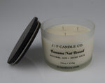 JF Candle Co. 16oz Banana Nut Bread soy candle with three hemp wicks in frosted glass jar, dark wooden lid resting beside it.