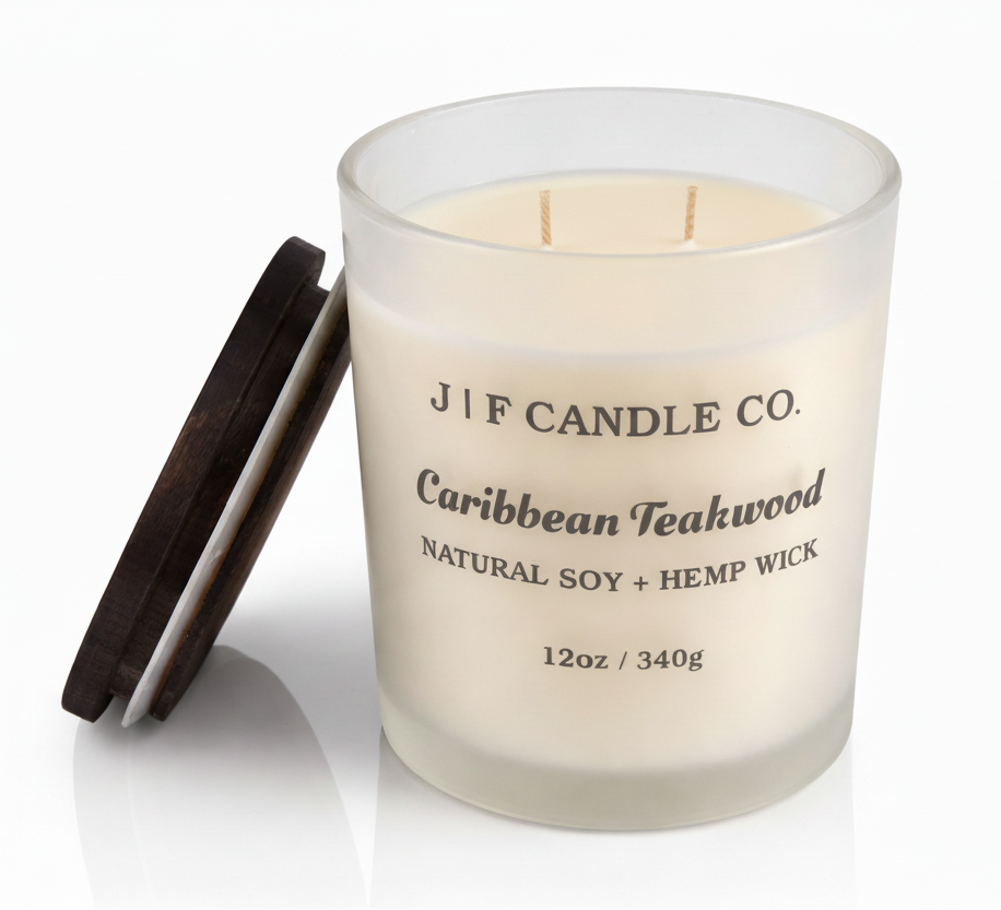 J | F Candle Co. Caribbean Teakwood 12 oz natural soy candle in frosted glass jar with lid off on clean white background with soft reflection