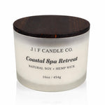 16oz Coastal Spa Retreat soy candle by J | F Candle Co. in a frosted glass jar with a wooden lid, clean white background product photo.
