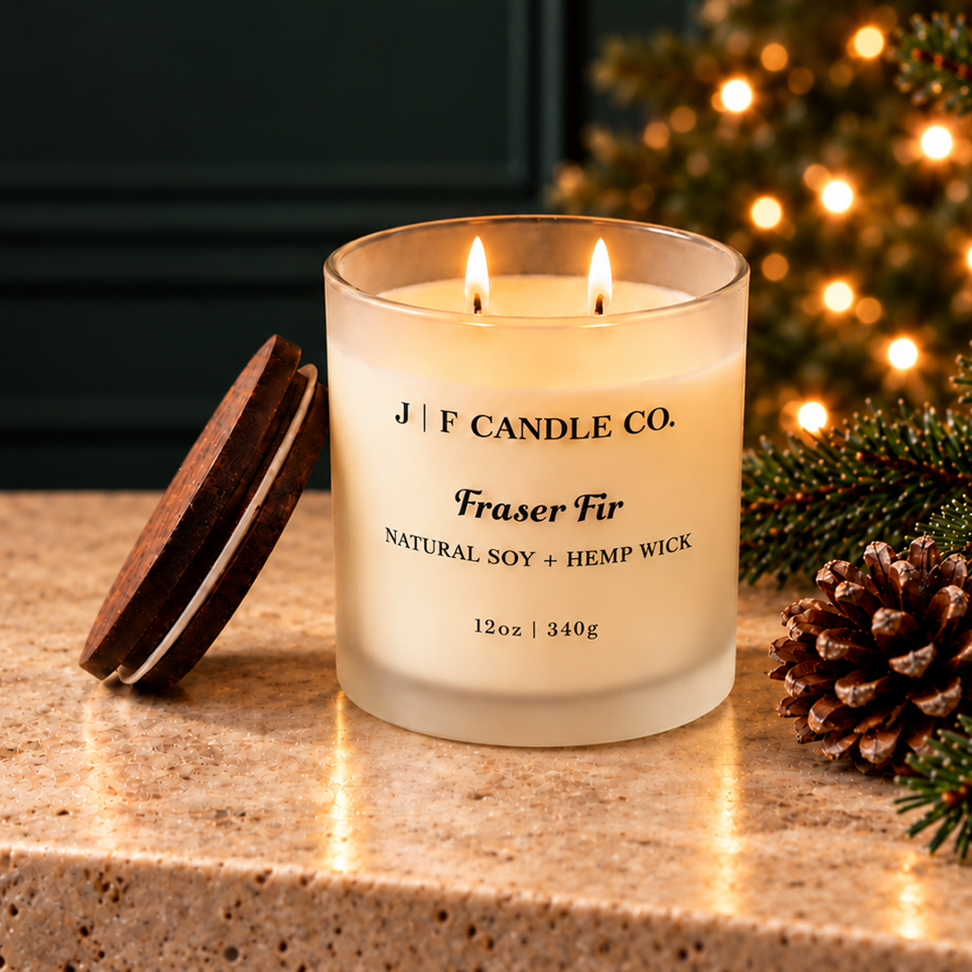Lit JF Candle Co. Pumpkin Pie soy candle styled in a warm fall setting