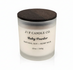 “J | F Candle Co. Baby Powder 12oz frosted glass soy candle with wooden lid on a clean background with soft reflection.”