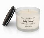 J | F Candle Co. Baby Powder 16oz three-wick soy candle in frosted glass jar with wooden lid beside candle and soft reflection on a clean white background.