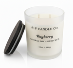 Open Bayberry soy candle in a frosted glass jar with wooden lid beside it on a white background with soft reflection, by J | F Candle Co.