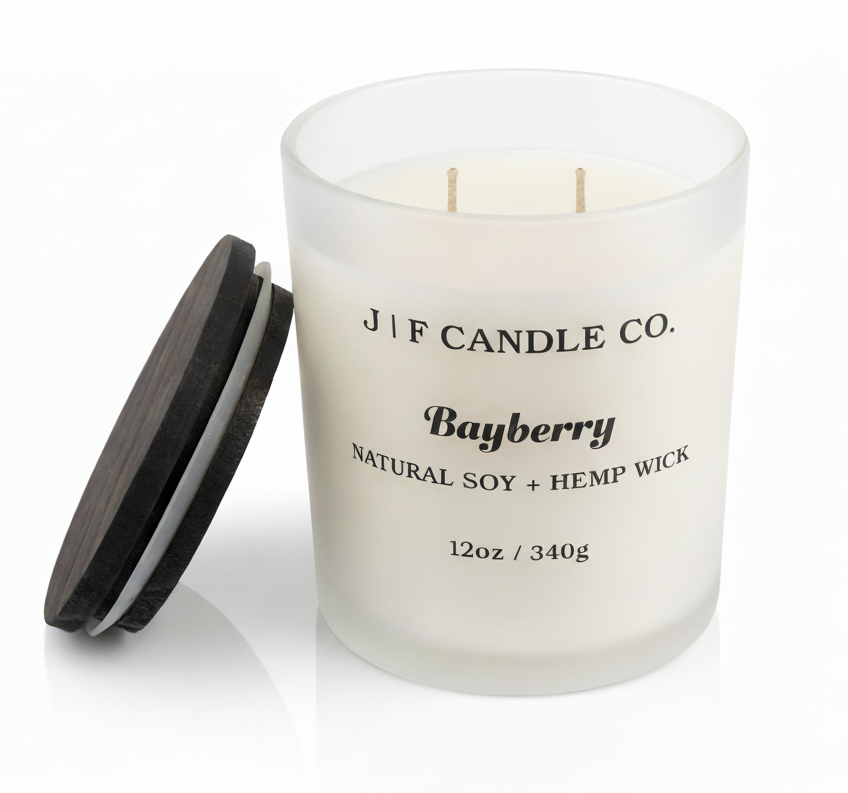 Open Bayberry soy candle in a frosted glass jar with wooden lid beside it on a white background with soft reflection, by J | F Candle Co.