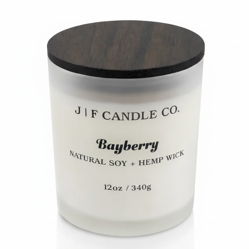 Bayberry soy candle in a frosted glass jar with wooden lid on a white background with soft reflection, by J | F Candle Co.