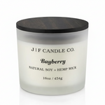 16 oz Bayberry soy candle in a frosted glass jar with wooden lid on a white background with soft reflection, by J | F Candle Co.