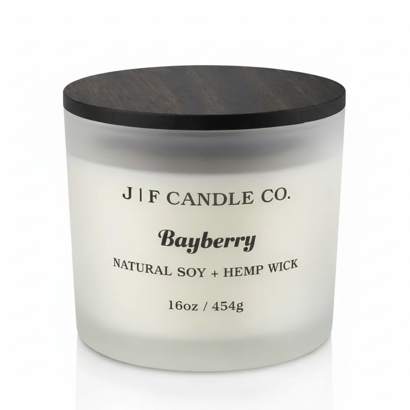 16 oz Bayberry soy candle in a frosted glass jar with wooden lid on a white background with soft reflection, by J | F Candle Co.