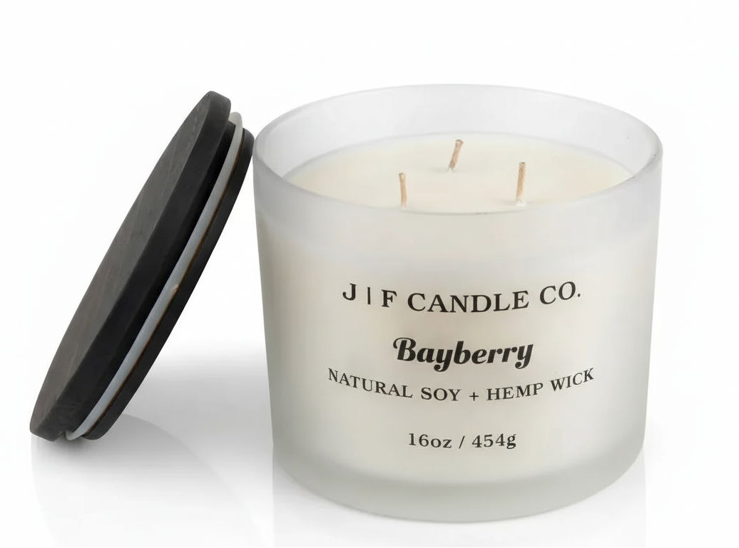 16 oz Bayberry soy candle in a frosted glass jar with wooden lid resting on jar a white background with soft reflection, by J | F Candle Co.