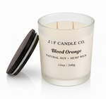Blood Orange luxury soy candle by J | F Candle Co. in frosted glass jar with wooden lid removed