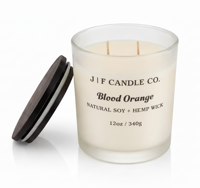 Blood Orange luxury soy candle by J | F Candle Co. in frosted glass jar with wooden lid removed