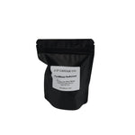 Caribbean Teakwood 2 oz soy wax melt package by JF Candle Co. in black resealable packaging on a gray background