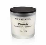 J | F Candle Co. Citronella 12oz soy candle in frosted glass jar with wooden lid on a clean white background with soft reflection