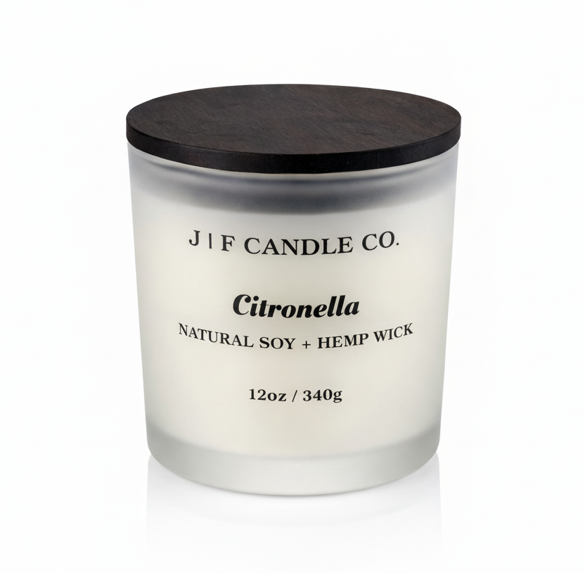 J | F Candle Co. Citronella 12oz soy candle in frosted glass jar with wooden lid on a clean white background with soft reflection