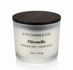 J | F Candle Co. Citronella 16oz soy candle in frosted glass jar with wooden lid on a clean white background with soft reflection