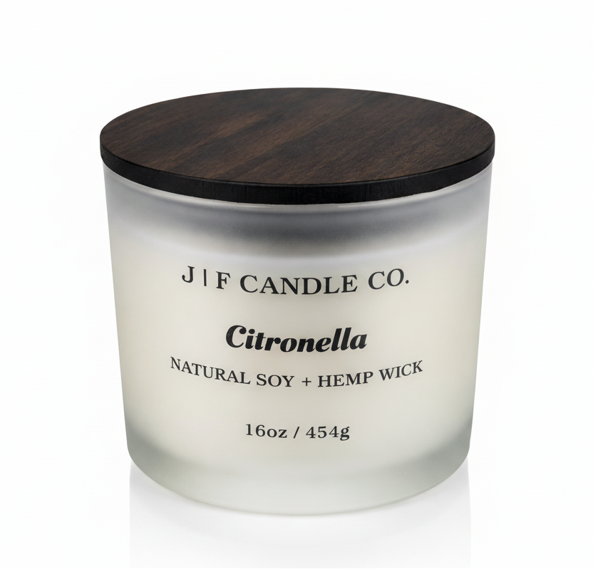 J | F Candle Co. Citronella 16oz soy candle in frosted glass jar with wooden lid on a clean white background with soft reflection