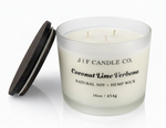 J | F Candle Co. Coconut Lime Verbena 16oz three-wick soy candle in frosted glass jar with wooden lid on clean white background with soft reflection