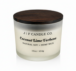 J | F Candle Co. Coconut Lime Verbena 16oz soy candle in frosted glass jar with wooden lid on a clean white background with soft reflection