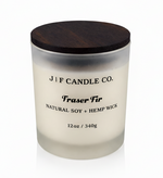 J | F Candle Co Fraser Fir 12oz soy candle in frosted glass jar with wooden lid on white background with soft reflection