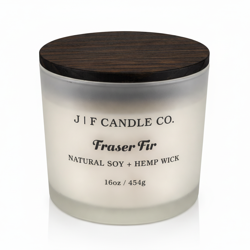 J | F Candle Co Fraser Fir 16oz soy candle in frosted glass jar with wooden lid on white background with soft reflection