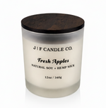 J | F Candle Co Fresh Apples 12oz soy candle in frosted glass jar with wooden lid on white background with soft reflection