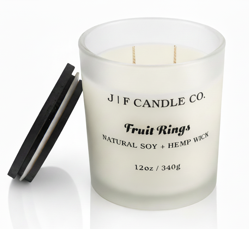 J | F Candle Co. Fruit Rings luxury soy candle in frosted glass jar with soft reflection on clean white background, 12oz