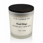 J | F Candle Co. Fruit Rings luxury soy candle with wooden lid in frosted glass jar on clean white background with soft reflection, 12oz