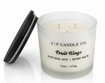J | F Candle Co. Fruit Rings luxury soy candle 16oz with lid off and double wicks in frosted glass jar on clean white background with soft reflection