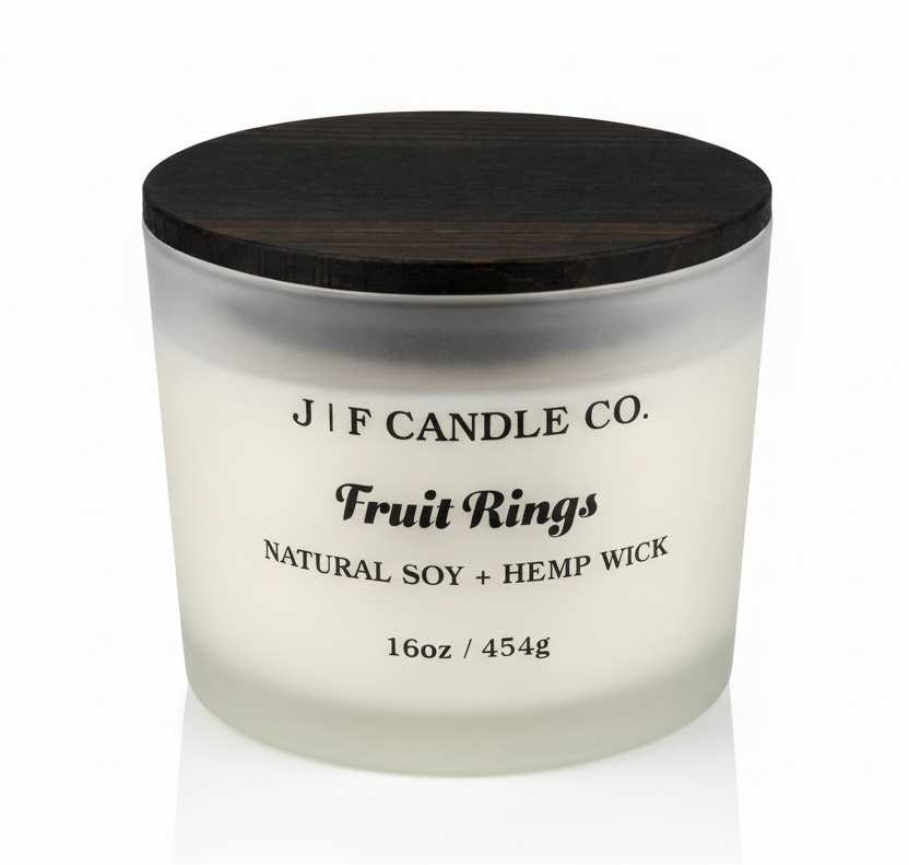 J | F Candle Co. Fruit Rings luxury soy candle 16oz in frosted glass jar with wooden lid on clean white background with soft reflection
