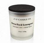 J | F Candle Co. Green Tea & Lemongrass luxury soy candle in frosted glass jar with wood lid, clean white background and soft reflection, 12oz