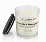 J | F Candle Co. Green Tea & Lemongrass luxury soy candle with lid off beside jar, frosted glass, clean white background with soft reflection, 12oz