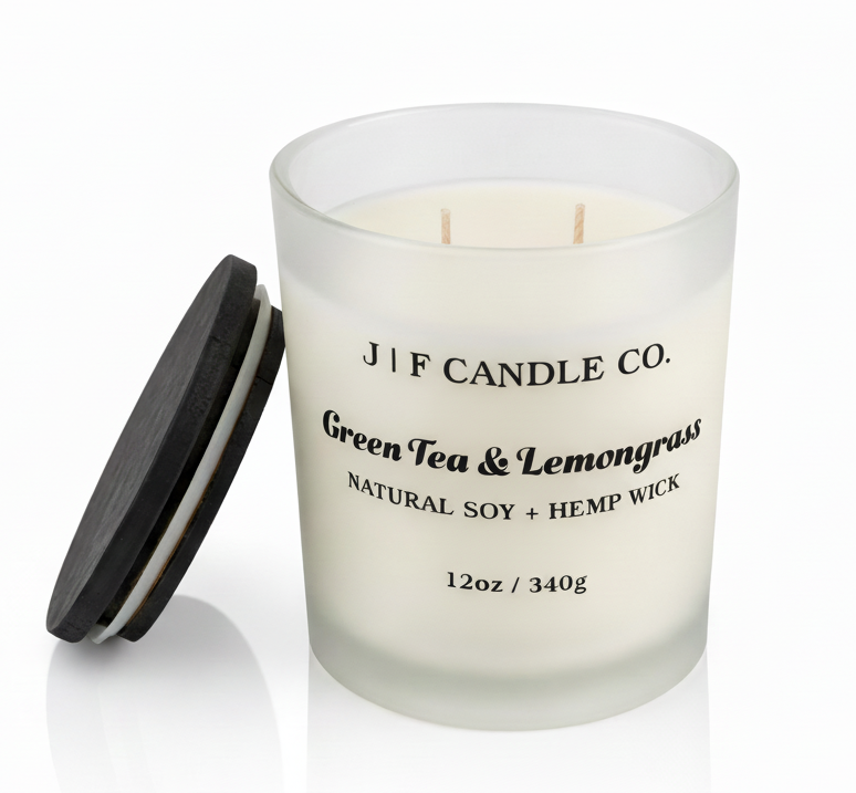J | F Candle Co. Green Tea & Lemongrass luxury soy candle with lid off beside jar, frosted glass, clean white background with soft reflection, 12oz