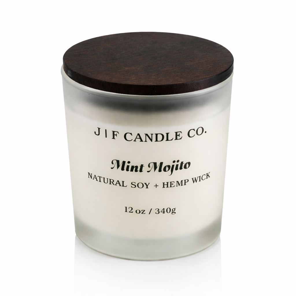 J | F Candle Co Mint Mojito luxury soy candle in frosted glass jar with wooden lid, clean white background and soft reflection, 12 oz