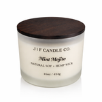J | F Candle Co Mint Mojito luxury soy candle in frosted glass jar with wooden lid, 16 oz size on clean white background with soft reflection