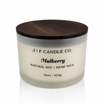J | F Candle Co Mulberry luxury soy candle in 16oz frosted glass jar with dark wood lid and soft reflection on clean white background