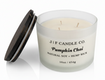 J | F Candle Co Pumpkin Chai 16oz luxury soy candle with three wicks and wooden lid beside jar on white background with soft reflection