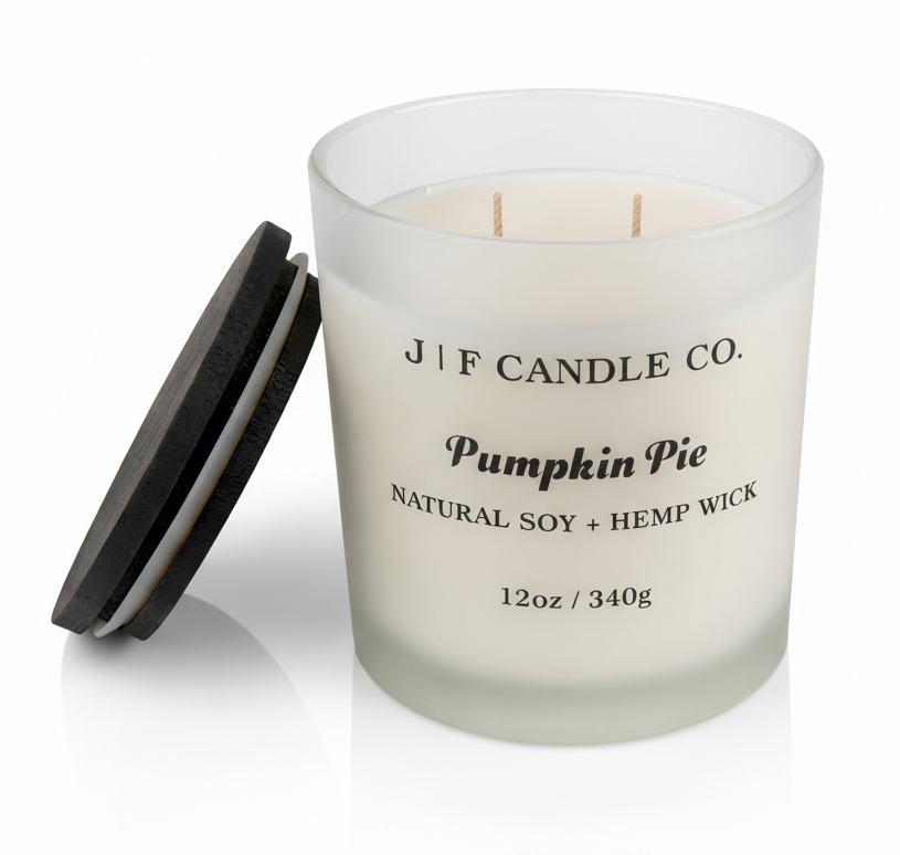 J | F Candle Co Pumpkin Pie 12oz luxury soy candle with wooden lid beside jar, clean frosted glass design on white background with soft reflection
