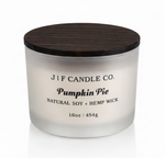 J | F Candle Co Pumpkin Pie 16oz luxury soy candle in frosted glass jar with wooden lid and soft reflection, clean minimalist product photo